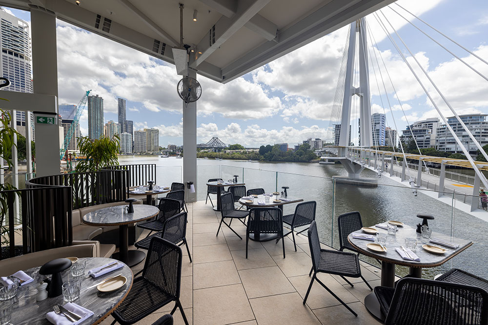 Stilts Dining Kangaroo Point Bridge Terrace seating with view at Stilts Dining